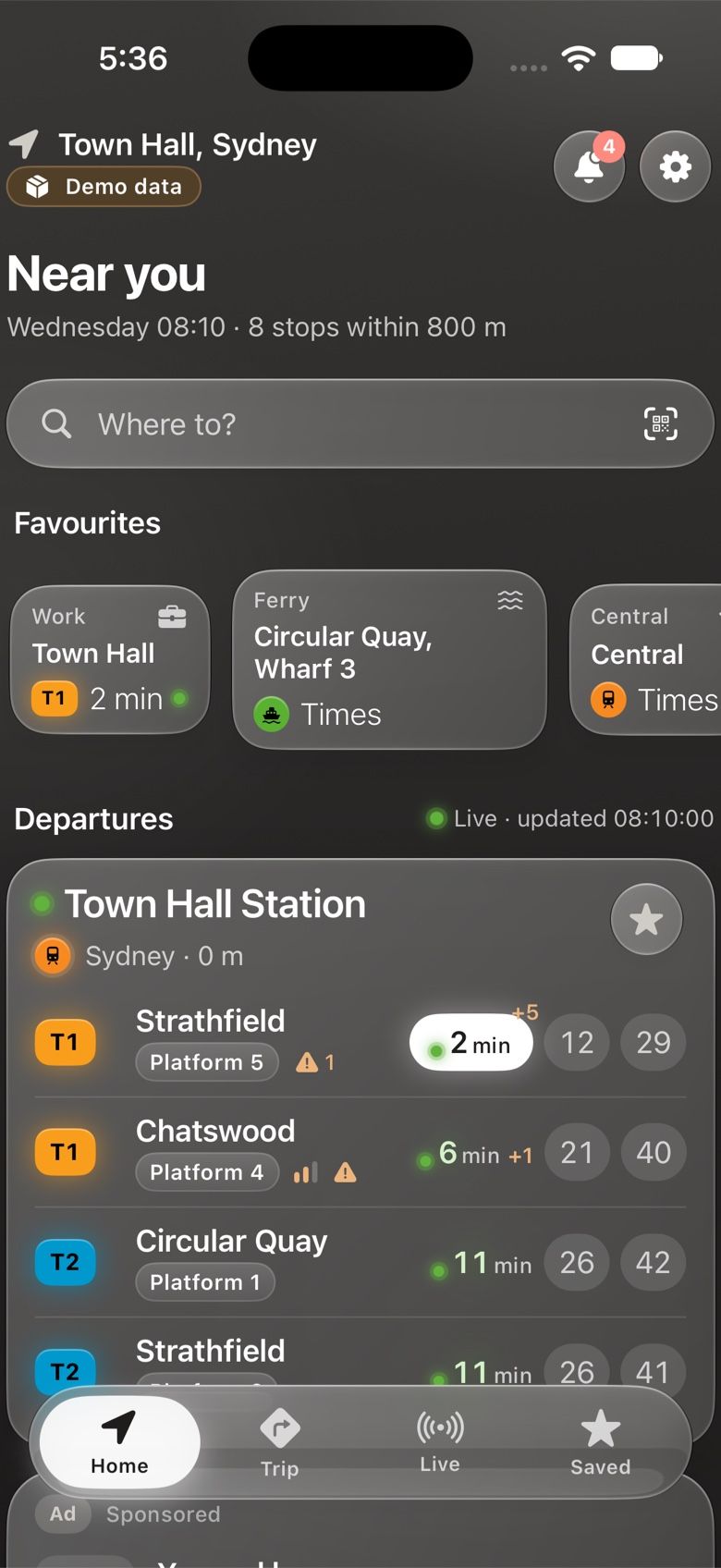The Home screen near Town Hall, Sydney: favourites on top, then Town Hall Station with T1 and T2 trains leaving in 2, 6 and 11 minutes, marked live.