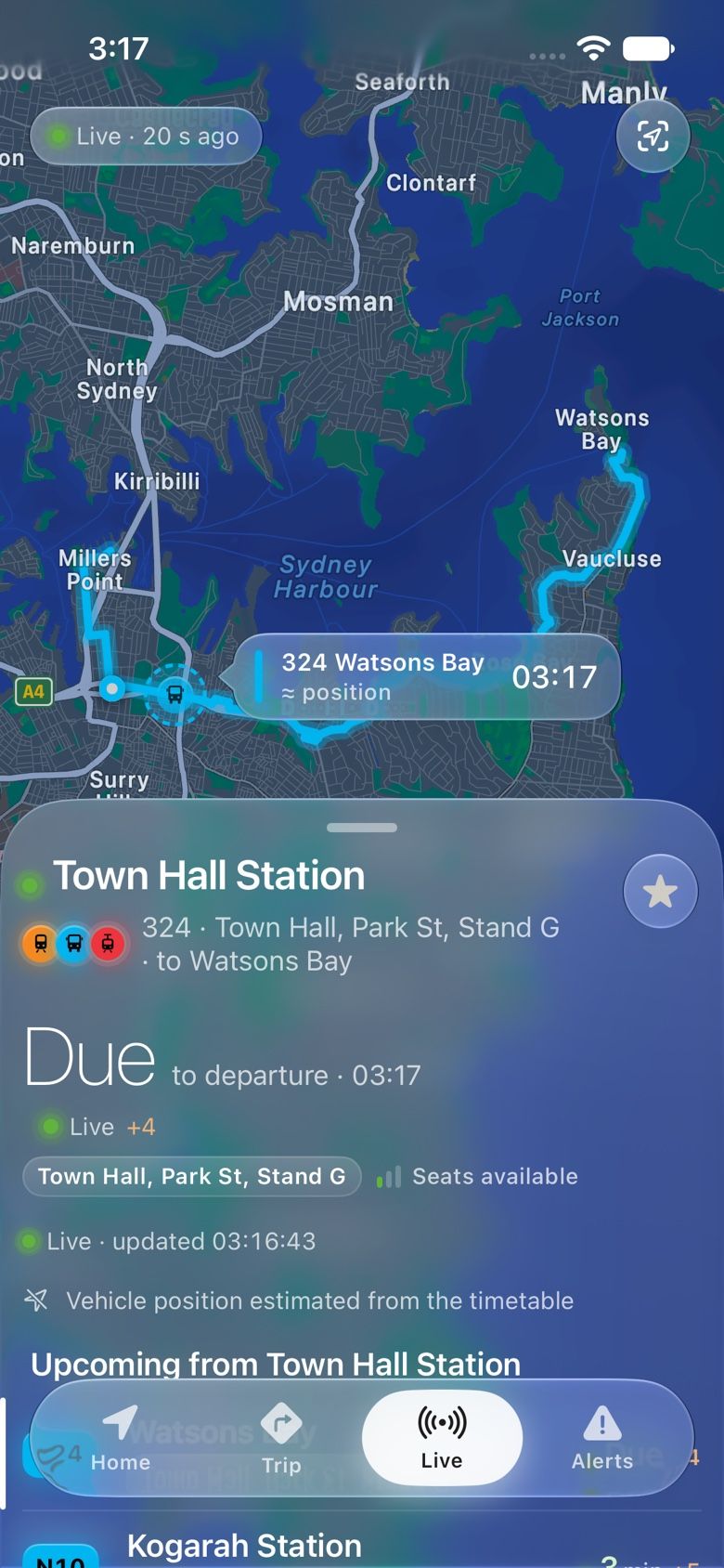 The Live screen: a map of Sydney Harbour following the 324 bus to Watsons Bay, with a sheet showing it due now at Town Hall, live, with seats available.